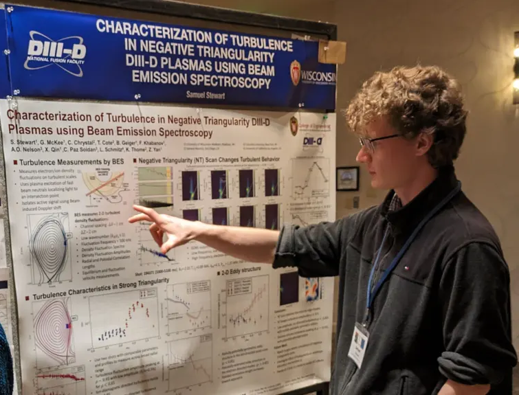 Student Sam Stewart explains his poster at 2024 US-EU Transport Task Force workshop